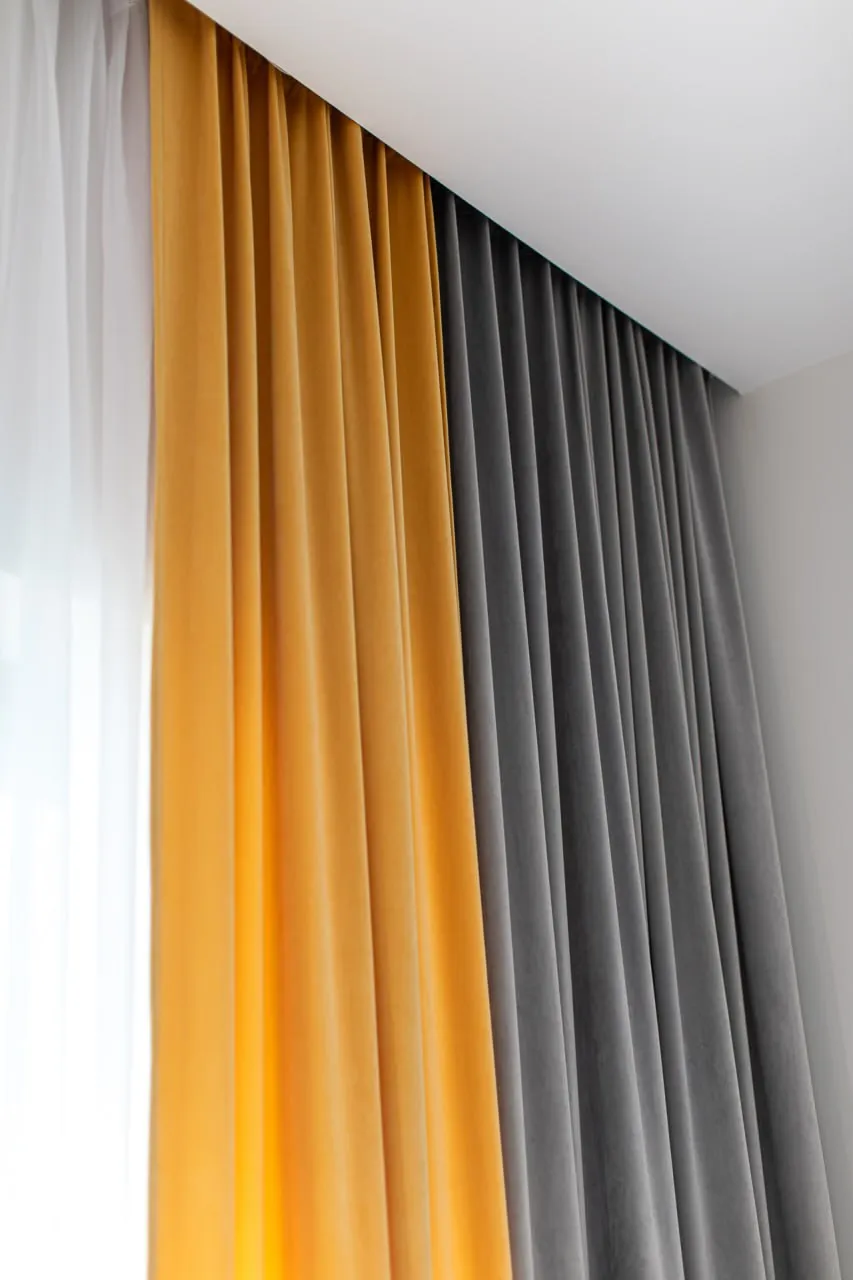 Curtain and sheer paired in a room at AKVAMARIN Bešeňová